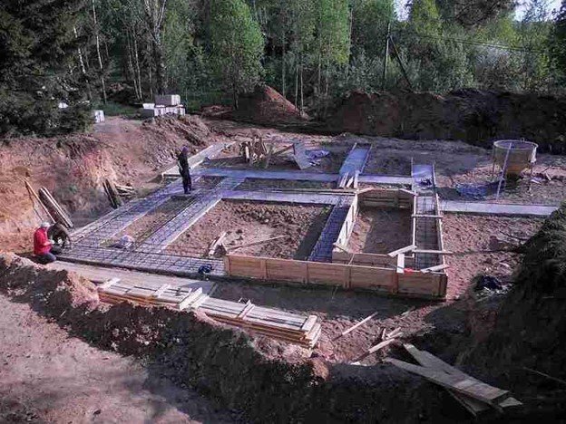 Concrete foundation installation with footing layout and excavation for residential build in Shaker Heights, OH