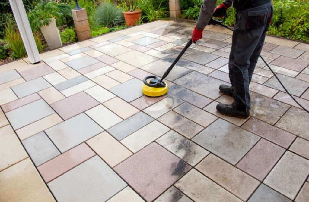 Cleaning and sealing decorative stamped concrete patio surface in residential backyard in Shaker Heights, OH