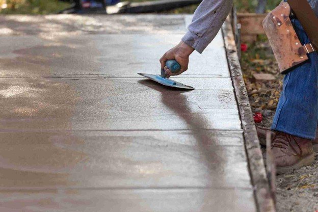 Newly installed concrete driveway with smooth finish and clean layout at residential home in Shaker Heights, OH